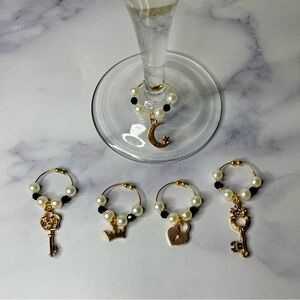 2/$15 ❤️❤️- Black & gold wine charms